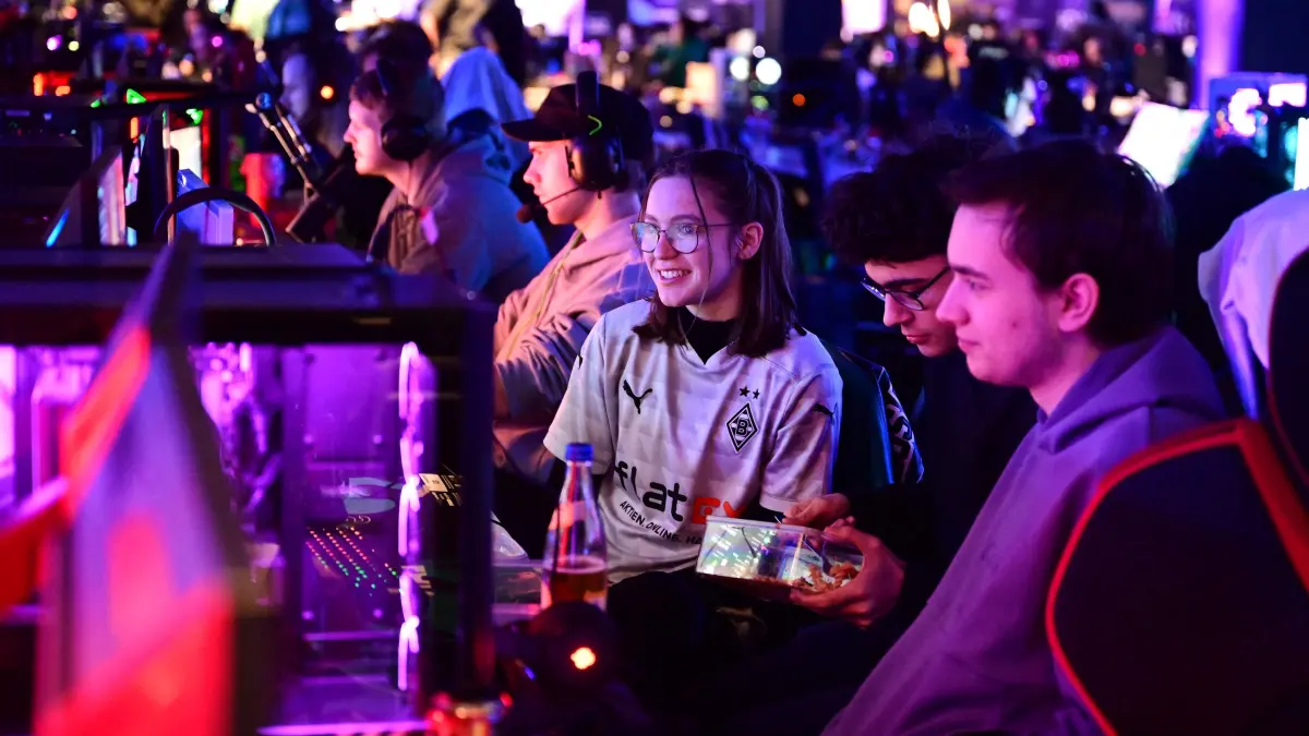 Gamers play video games during the Gamescom LAN event in a hall of the Trade Fair Center in Cologne, western Germany, on March 16, 2024. Around 1,200 gaming fans will gather in a Cologne exhibition hall for the Gamescom LAN, which will feature e-sports tournaments with prize money in games such as Counter-Strike, League of Legends and Rocket League. The event takes place from 15 to 17 March 2024. (Photo by Ina FASSBENDER / AFP)