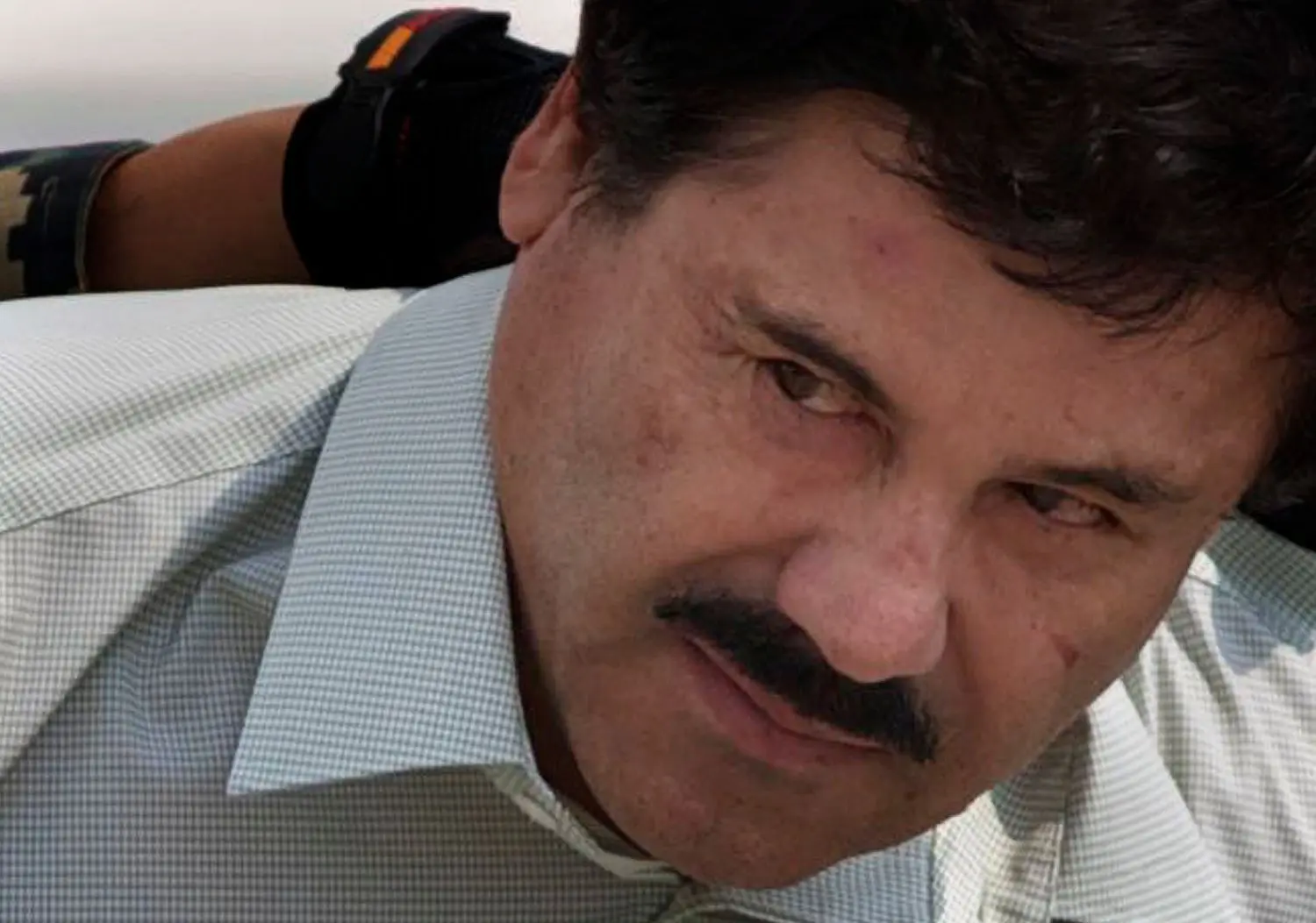 Der mexikanische Drogenboss Joaquin "El Chapo" Guzman wird am 22.02.2014 in Mexiko-Stadt (Mexiko) abgeführt.