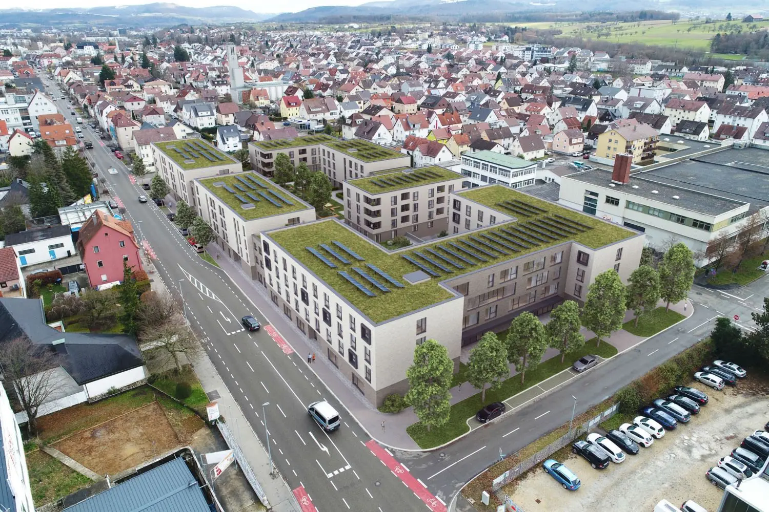 Die Visualisierung zeigt das Vorhaben in Blickrichtung Osten. Vorne, als Abgrenzung zum Industriegebiet, ist das Pflegeheim vorgesehen.