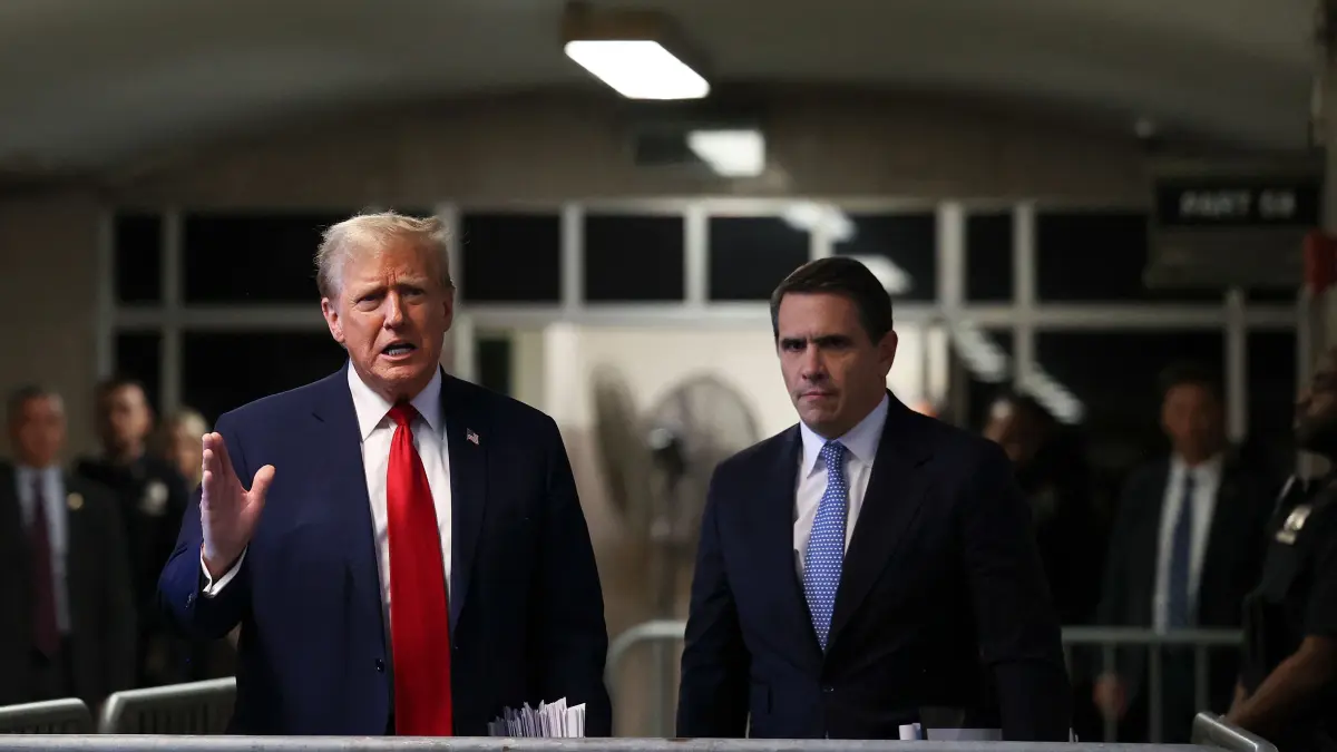 Former US President Donald Trump, with attorney Todd Blanche (R), speaks to the press after attending his trial for allegedly covering up hush money payments linked to extramarital affairs, at Manhattan Criminal Court in New York City on April 23, 2024. Trump faces a contempt of court hearing on Tuesday as part of his historic criminal trial, with New York prosecutors insisting the former president repeatedly violated the gag order issued to prevent him from intimidating witnesses. (Photo by Yuki Iwamura / POOL / AFP)