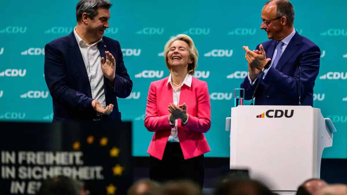 Bavaria's State Premier and leader of the conservative Christian Social Union (CSU) party Markus Soeder (L) looks on as the leader of Germany's Christian Democratic Union (CDU) Friedrich Merz (R) thanks European Commission President and EPP lead candidate standing for re-election, Ursula von der Leyen for her speech on the last day of the CDU party congress at the Estrel Berlin Hotel in Berlin, on May 8, 2024. (Photo by John MACDOUGALL / AFP)