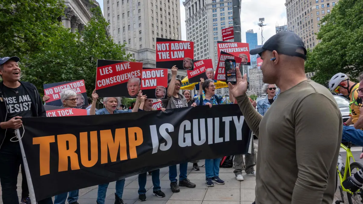 Jury Continues Deliberations In Trump Hush Money Trial: NEW YORK, NEW YORK - MAY 30: People react moments after news that former U.S. President Donald Trump was found guilty in his trial on hush-money payments in Manhattan Criminal Court on May 30, 2024 in New York City. The former president was found guilty on all 34 felony counts of falsifying business records in the first of his criminal cases to go to trial. Spencer Platt/Getty Images/AFP (Photo by SPENCER PLATT / GETTY IMAGES NORTH AMERICA / Getty Images via AFP)