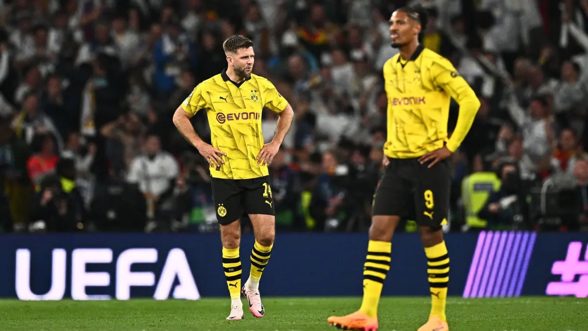 Borussia Dortmund — Real Madrid: 01.06.2024, Großbritannien, London: Fußball: Champions League, Borussia Dortmund - Real Madrid, K.o.-Runde, Finale im Wembley Stadion, Dortmunds Niclas Füllkrug und Sebastien Haller (r) reagieren nach dem Spiel. Foto: Tom Weller/dpa +++ dpa-Bildfunk +++