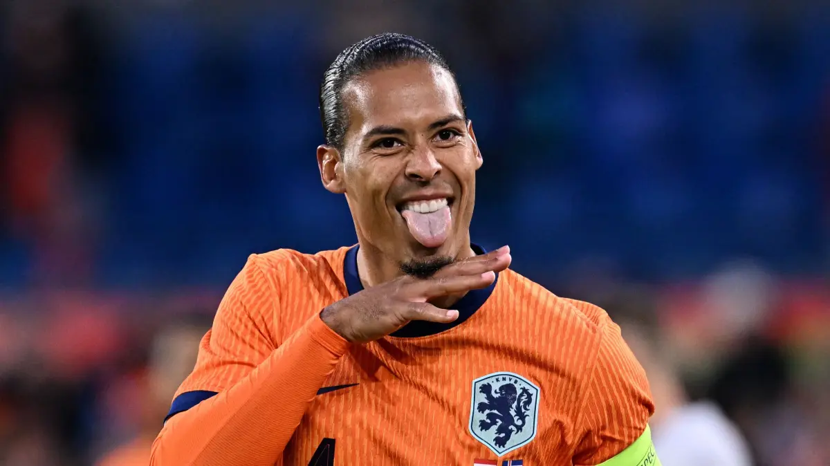 Netherlands' defender #04 Virgil van Dijk celebrates after scoring his teams second goal during the International friendly football match between Netherlands and Iceland at the Feyenoord Stadium, in Rotterdam, on June 10, 2024. (Photo by JOHN THYS / AFP)