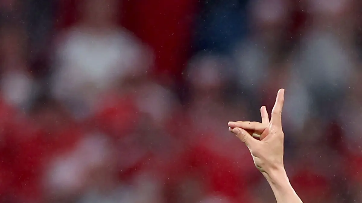 (FILES) Turkey's defender #03 Merih Demiral makes a controversial hand gesture as he celebrates scoring his team's second goal during the UEFA Euro 2024 round of 16 football match between Austria and Turkey at the Leipzig Stadium in Leipzig on July 2, 2024. Turkey defender Merih Demiral will miss his team's Euro 2024 quarter-final clash with the Netherlands after UEFA suspended him for two games on July 5, 2024 for making an alleged ultra-nationalist salute. Demiral scored a brace in the 2-1 last 16 win over Austria on July 2, 2024 and during celebrations for his second goal made a gesture associated with Turkish right-wing extremist group Grey Wolves. UEFA said in a statement Demiral was banned "for violating the basic rules of decent conduct, for using sports events for manifestations of a non-sporting nature and for bringing the sport of football into disrepute." (Photo by Ronny HARTMANN / AFP)