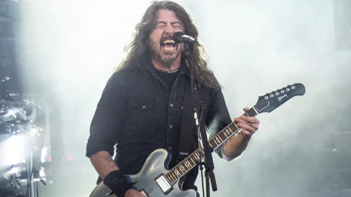 US musician Dave Grohl of rock band Foo Fighters performs on the Orange Stage at Roskilde Festival on July 5, 2024 in Roskilde, Denmark. (Photo by Helle Arensbak / Ritzau Scanpix / AFP) / Denmark OUT