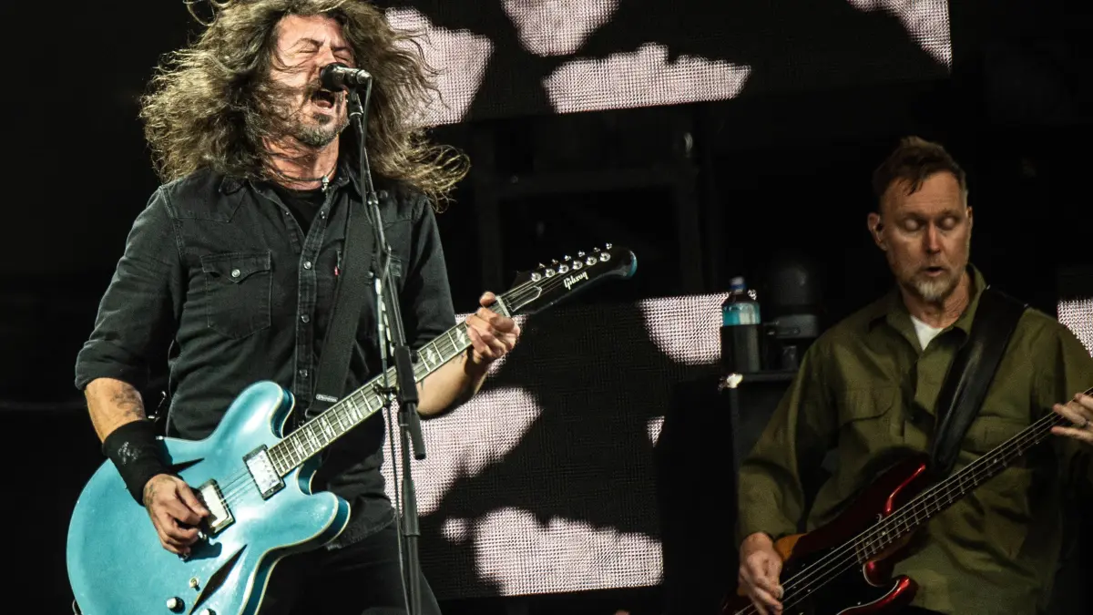 US musician Dave Grohl (L) of rock band Foo Fighters performs on the Orange Stage at Roskilde Festival on July 5, 2024 in Roskilde, Denmark. (Photo by Helle Arensbak / Ritzau Scanpix / AFP) / Denmark OUT