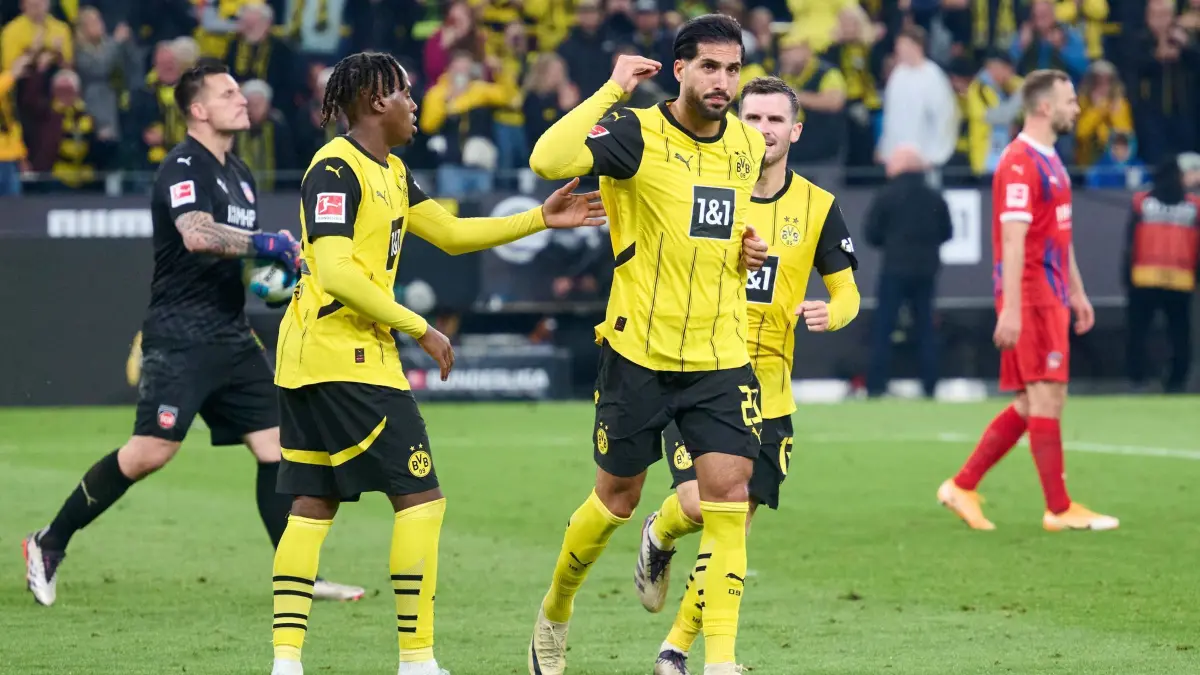 Borussia Dortmund - 1. FC Heidenheim: 13.09.2024, Nordrhein-Westfalen, Dortmund: Fußball, Bundesliga, Borussia Dortmund - 1 FC Heidenheim, 3 Spieltag, Signal Iduna Park, Dortmunds Emre Can (M) jubelt mit Jamie Gittens (l) und Pascal Groß über sein Tor zum 4:2. Links Torwart Kevin Müller von Heidenheim. Foto: Bernd Thissen/dpa - WICHTIGER HINWEIS: Gemäß den Vorgaben der DFL Deutsche Fußball Liga bzw. des DFB Deutscher Fußball-Bund ist es untersagt, in dem Stadion und/oder vom Spiel angefertigte Fotoaufnahmen in Form von Sequenzbildern und/oder videoähnlichen Fotostrecken zu verwerten bzw. verwerten zu lassen. +++ dpa-Bildfunk +++