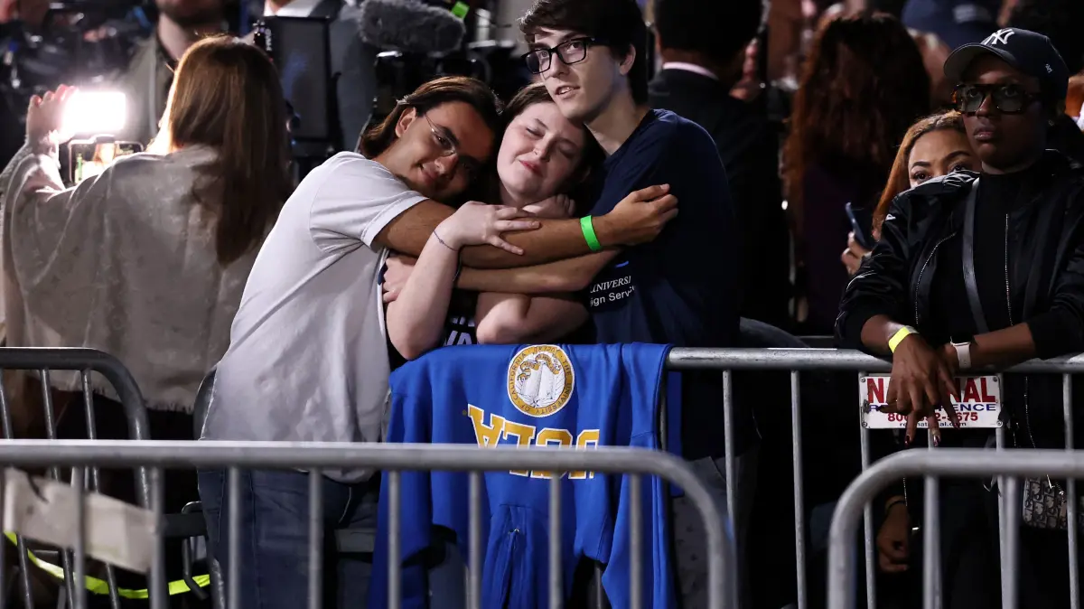 Democratic Presidential Nominee Vice President Kamala Harris Holds Election Night Event At Howard University: WASHINGTON, DC - NOVEMBER 05: Supporters embrace as they watch poll results come in during an election night event for Democratic presidential nominee, U.S. Vice President Kamala Harris at Howard University on November 05, 2024 in Washington, DC. Americans cast their ballots today in the presidential race between Republican nominee former President Donald Trump and Vice President Kamala Harris, as well as multiple state elections that will determine the balance of power in Congress. Anna Rose Layden/Getty Images/AFP (Photo by Anna Rose Layden / GETTY IMAGES NORTH AMERICA / Getty Images via AFP)