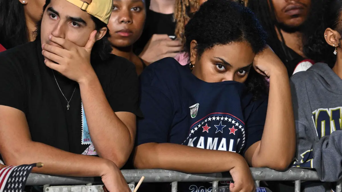 Supporters of US Vice President and Democratic presidential candidate Kamala Harris react as they watch results come in during an election night event at Howard University in Washington, DC, on November 5, 2024. (Photo by ANDREW CABALLERO-REYNOLDS / AFP)