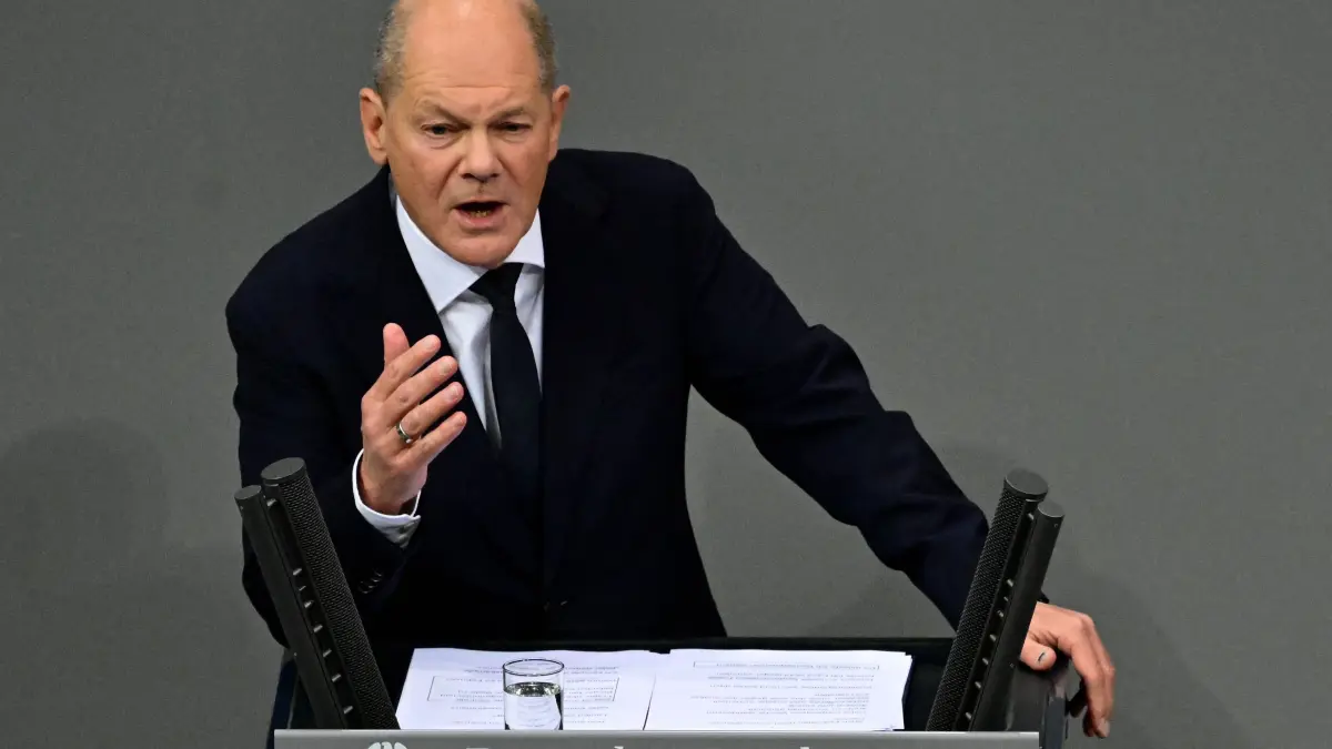 German Chancellor Olaf Scholz gives a speech during a session on November 13, 2024 at the Bundestag (lower house of parliament) in Berlin, following the breakdown of his three-party coalition. Germany is headed for snap elections on February 23, the main parties agreed on November 12, aiming to form a stable government after Chancellor Olaf Scholz's three-party coalition collapsed on November 6, 2024. The agreement seeks to quickly restore political stability at a time when Europe's biggest economy is set to shrink for a second year in a row and amid heightened geopolitical volatility, with wars raging in Ukraine and the Middle East and president-elect Donald Trump readying to take power in the US in January 2025. (Photo by John MACDOUGALL / AFP)