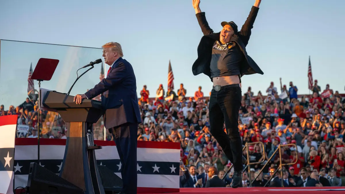 Republican presidential nominee Donald Trump holds a rally at site of first assassination attempt: TOPSHOT - -- AFP PICTURES OF THE YEAR 2024 --
Tesla and SpaceX CEO Elon Musk (R) jumps on stage as he joins former US President and Republican Presidential candidate Donald Trump (L) during a campaign rally at the site of the former President's first assassination attempt, in Butler, Pennsylvania on October 5, 2024.? (Photo by Jim WATSON / AFP) / AFP PICTURES OF THE YEAR 2024