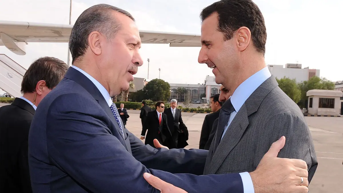 (FILES) -- A file picture released by the official Syrian News Agency SANA shows President Bashar al-Assad (R) welcoming Turkey's Prime Minister Recep Tayyip Erdogan at Damascus airport on January 17, 2011. Islamist-led rebels declared that they have taken Damascus in a lightning offensive on December 8, 2024, sending Assad fleeing and ending five decades of Baath rule in Syria. Erdogan, whose government backs some armed groups in the Syrian northern, said on December 7 that Syria "is tired of war, blood and tears". (Photo by SANA / AFP)