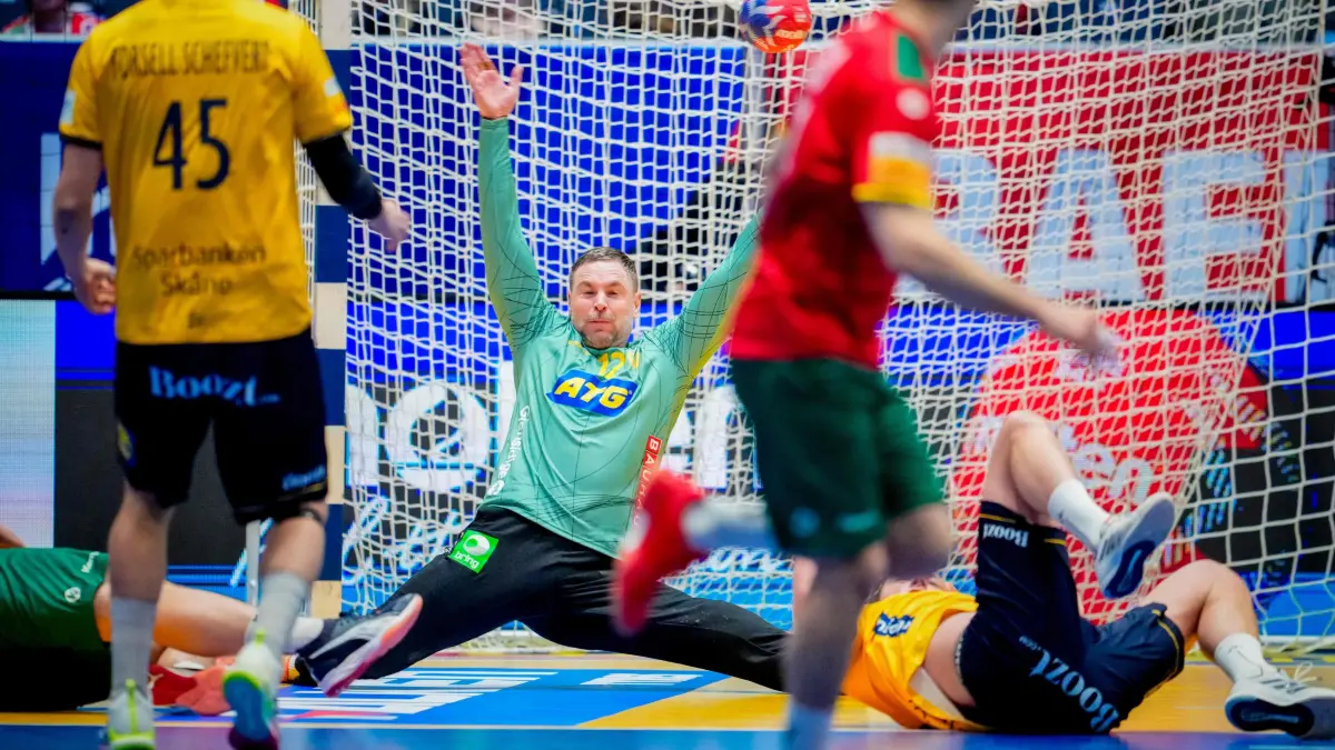 Sweden's goalkeeper #12 Andreas Palicka dives for the ball during the Main Round group II match of the IHF Men's Handball World Championship Sweden vs Portugal in Fornebu, west of Oslo, Norway on January 22, 2025. (Photo by Beate Oma Dahle / NTB / AFP) / Norway OUT