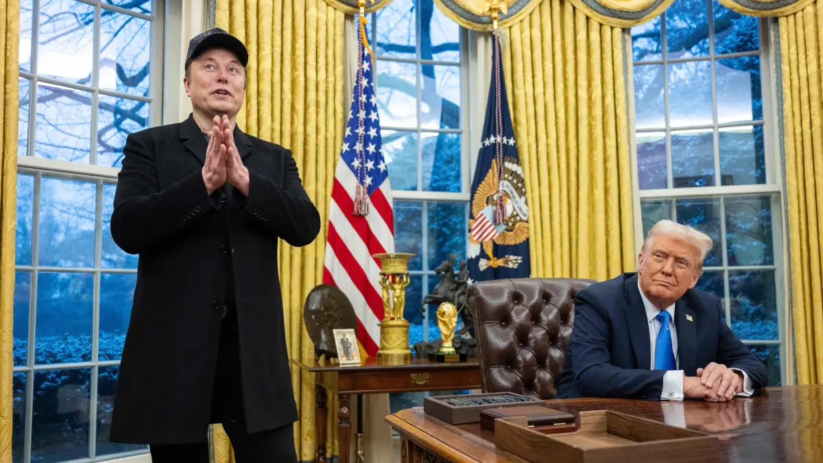 Elon Musk speaks as US President Donald Trump looks on in the Oval Office of the White House in Washington, DC, on February 11, 2025. Tech billionaire Elon Musk, who has been tapped by President Donald Trump to lead federal cost-cutting efforts, said the United States would go "bankrupt" without budget cuts. Musk leads the efforts under the newly created Department of Government Efficiency (DOGE), and was speaking at the White House with Trump, who has in recent weeks unleashed a flurry of orders aimed at slashing federal spending. (Photo by Jim WATSON / AFP)