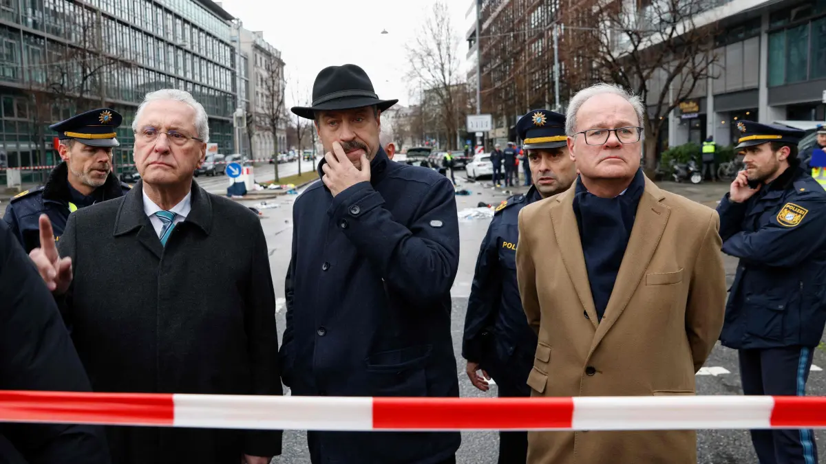 Car drives into crowd in Munich, several injured: German police: Bavaria's State Premier and Leader of the conservative Christian Social Union (CSU) Markus Soeder (C) arrives with Joachim Herrmann (L), Bavaria's Interior Minister at the scene where a car drove into a crowd in the southern German city of Munich on February 13, 2025 leaving several people injured, police said. Munich police said on social media platform X that "several people were injured" after "a car drove into a group of people" in the centre of the Bavarian state capital. (Photo by Michaela STACHE / AFP)