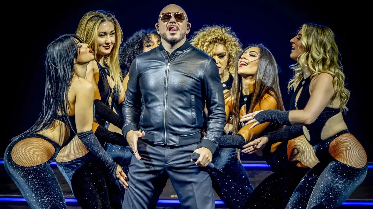Cuban-American rapper Pitbull performs on the stage of the Ziggo Dome in Amsterdam, on February 24, 2025. (Photo by Robin Utrecht / ANP / AFP) / Netherlands OUT