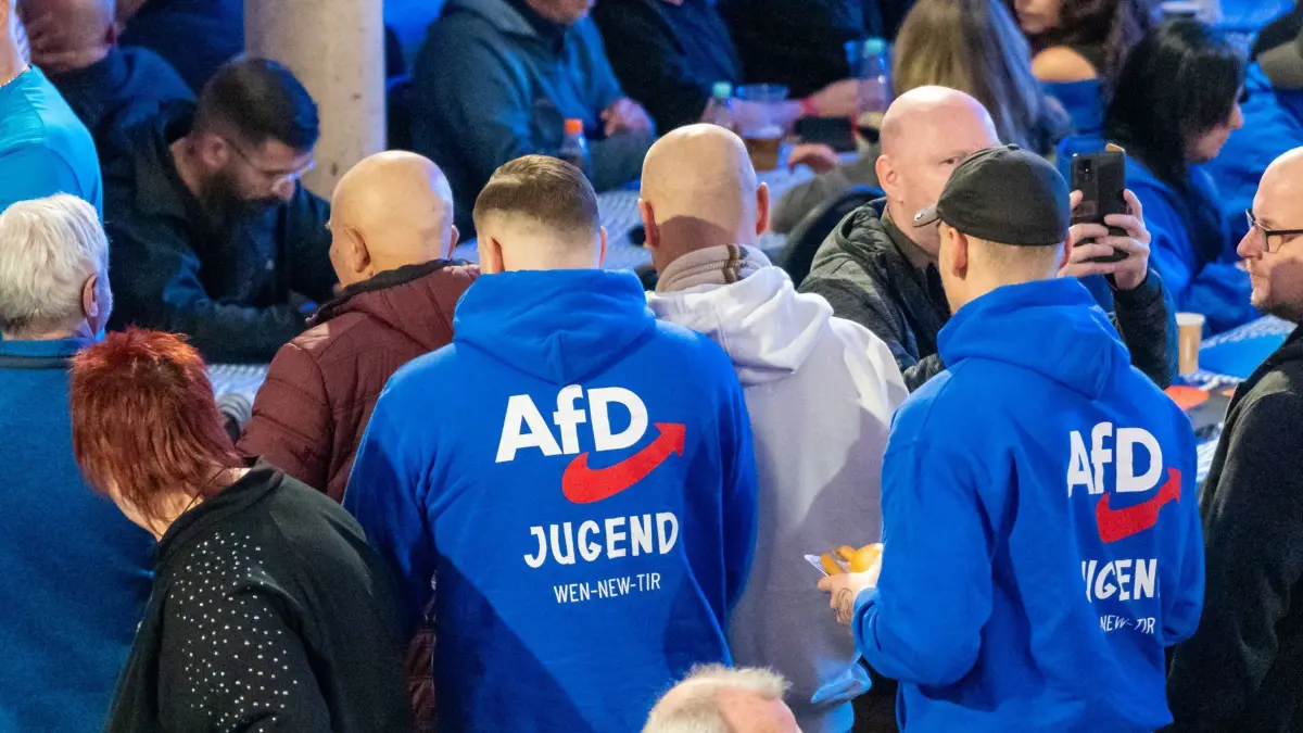 Greding, Bavaria, Germany - February 7, 2025: Election campaign event of the AfD Alternative for Germany in Greding. Young men with clothes of the AfD youth *** Wahlkampfveranstaltung der AfD Alternative für Deutschland in Greding. Junge Männer mit kleidung der AfD Jugend