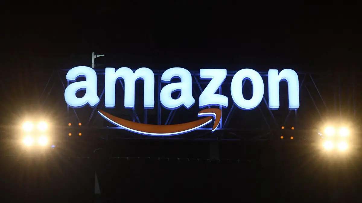 (FILES) An Amazon logo is pictured in New Delhi on January 15, 2020. On February 26, 2025, online retail behemoth Amazon announced a new version of its Alexa voice assistant that is powered by generative artificial intelligence, giving the device more human-like qualities. (Photo by Sajjad HUSSAIN / AFP)