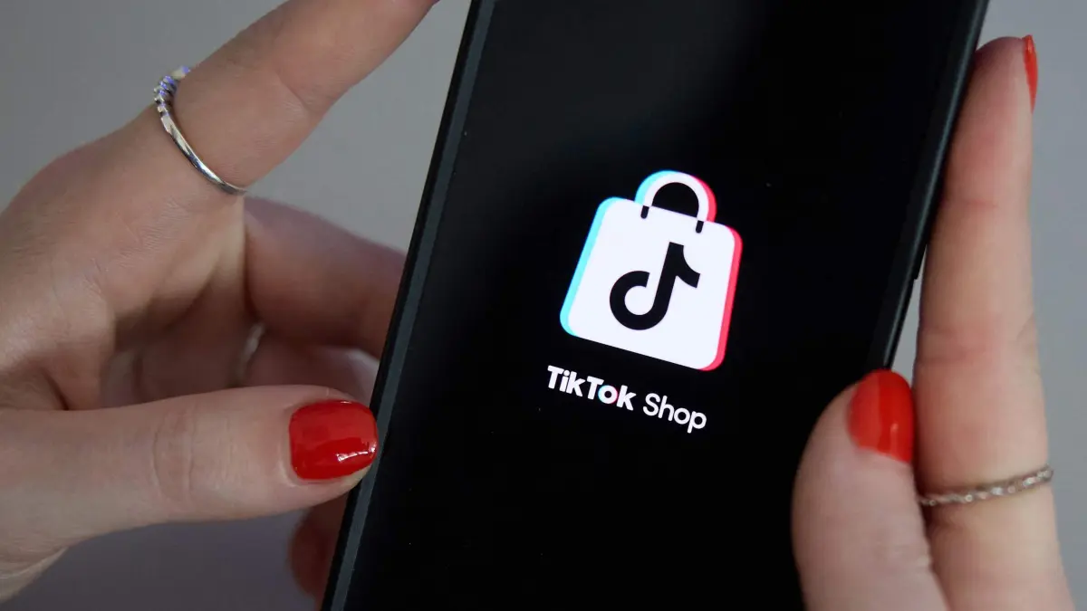This photograph taken on March 15, 2025 in Paris shows the logo of the Chinese social media application Tik Tok Shop on the screen of an iphone as the platform rolls out it's shopping division in Europe. (Photo by Kiran RIDLEY / AFP)