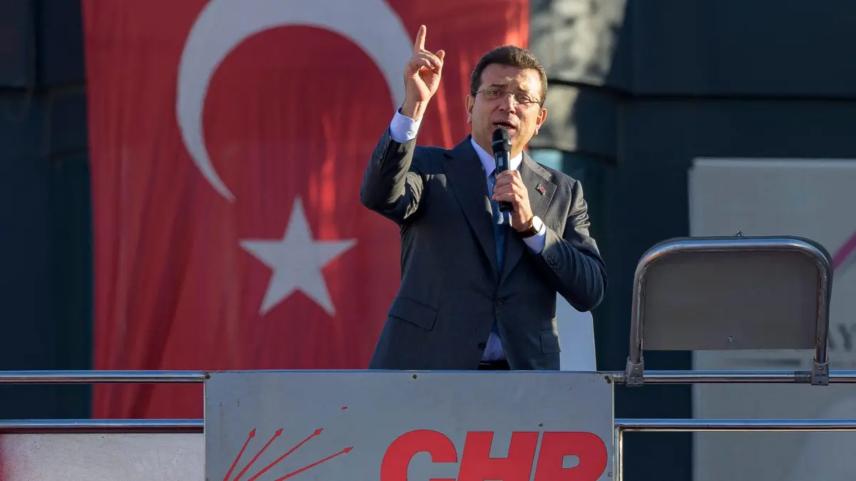 (FILES) Istanbul's Mayor Ekrem Imamoglu delivers a speech during a demonstration following the arrest of the Mayor of Esenyurt, at the Esenyurt Square in Istanbul, on October 31, 2024. The mayor of Istanbul, Ekrem Imamoglu, the main opponent of Turkish President Recep Tayyip Erdogan, was arrested on March 19, 2025 in the morning along with dozens of his aides, elected representatives and members of his party, accused of ?corruption?, according to the city's public prosecutor. The state-run Anadolu agency also cited charges of ?terrorism? and ?aiding the PKK?, the outlawed Kurdistan Workers' Party, against seven suspects, including Mr Imamoglu. (Photo by Yasin AKGUL / AFP)