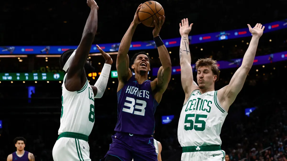 Charlotte Hornets v Boston Celtics: BOSTON, MA - APRIL 11: Jaylen Sims #33 of the Charlotte Hornets tries to get a shot off between Baylor Scheierman #55 and Neemias Queta #88 of the Boston Celtics during the second half at TD Garden on April 11, 2025 in Boston, Massachusetts. NOTE TO USER: User expressly acknowledges and agrees that, by downloading and/or using this Photograph, user is consenting to the terms and conditions of the Getty Images License Agreement. (Photo By Winslow Townson/Getty Images) (Photo by Winslow Townson / GETTY IMAGES NORTH AMERICA / Getty Images via AFP)
