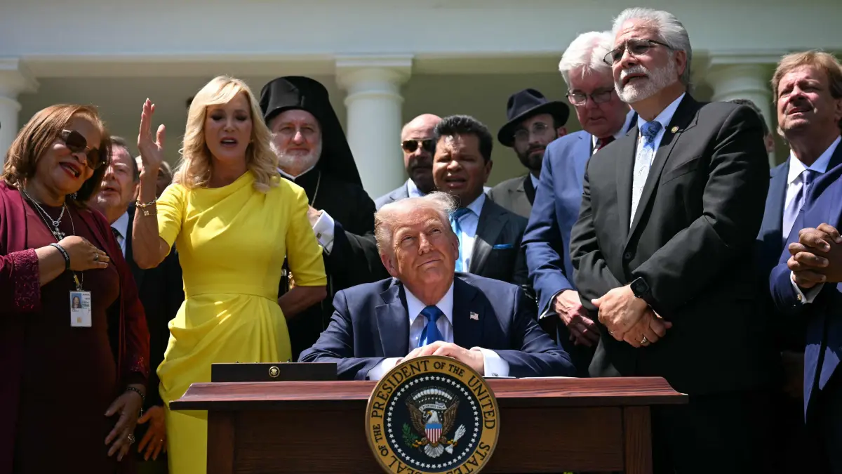 Trump participates to a National day of prayer event: Pastor Paula White (2nd L) and other faith leaders pray behind US President Donald Trump during a National Day of Prayer event in the Rose Garden of the White House in Washington, DC, on May 1, 2025. (Photo by Jim WATSON / AFP)