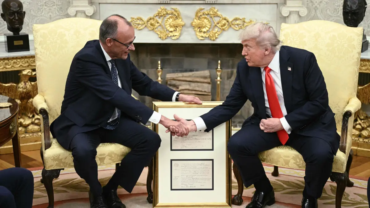 President Donald Trump hosts German Chancellor Friedrich Merz: US President Donald Trump and German Chancellor Friedrich Merz (L) shake hands during a bilateral meeting in the Oval Office of the White House in Washington, DC, on June 5, 2025. A month into his job, the conservative Merz, 69, will try to build a rapport with the mercurial Trump as he seeks to maintain good ties with the country he considers post-war Germany's "indispensable" ally. (Photo by Brendan SMIALOWSKI / AFP)