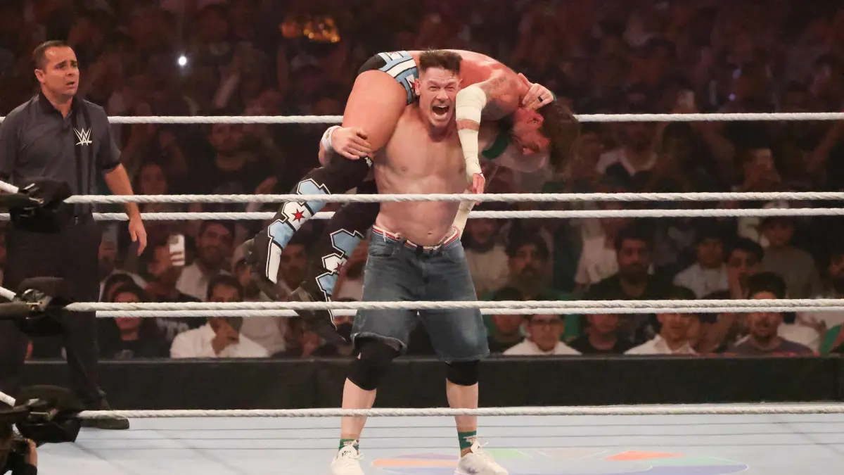 US wrestler John Cena (front) fights against CM Punk for the undisputed WWE Championship during the King of the Ring event at Kingdom Arena in Riyadh on June 28, 2025. (Photo by Fayez Nureldine / AFP)