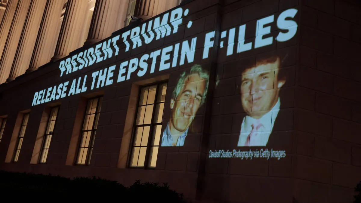 Activists Project Message To Trump Calling For Release Of Epstein Files: WASHINGTON, DC - JULY 18: An image of U.S. President Donald Trump and Jeffrey Epstein, along with the words “President Trump: Release All the Epstein Files”, is projected onto the U.S. Department of Commerce headquarters on July 18, 2025, in Washington, D.C. Earlier today, the Department of Justice asked federal judges to unseal files in the criminal cases of Jeffrey Epstein and Ghislaine Maxwell. Anna Moneymaker/Getty Images/AFP (Photo by Anna Moneymaker / GETTY IMAGES NORTH AMERICA / Getty Images via AFP)