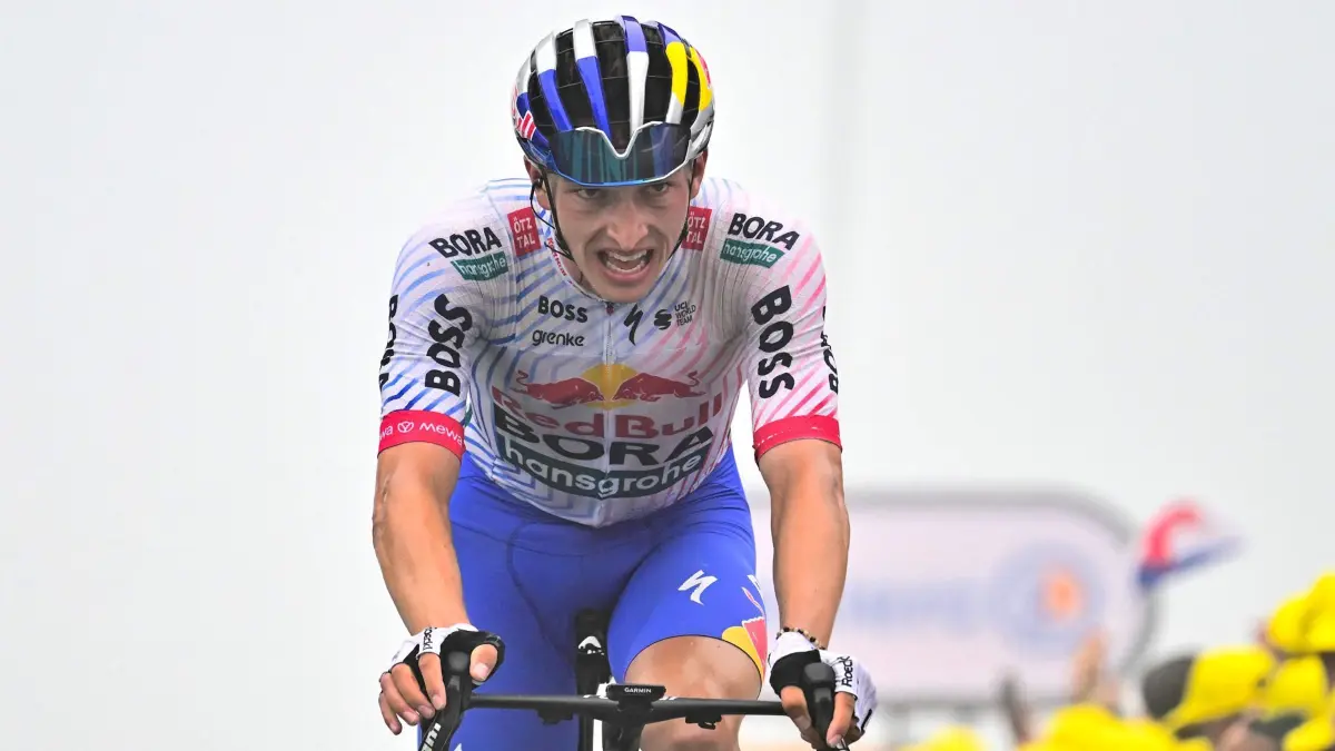 Red Bull - BORA - hansgrohe team's German rider Florian Lipowitz cycles to the finish line of the 14th stage of the 112th edition of the Tour de France cycling race, 182.6 km between Pau and Luchon-Superbagneres, in the Pyrenees mountains of southwestern France, on July 19, 2025. (Photo by Marco BERTORELLO / AFP)