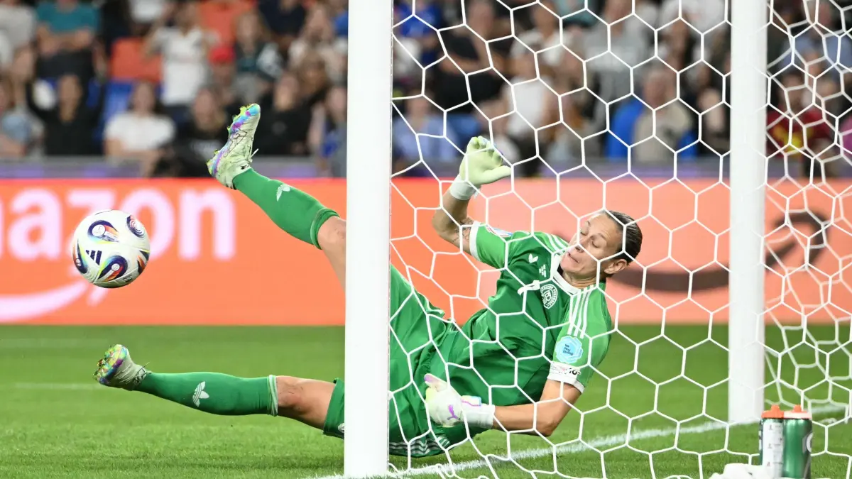 Germany's goalkeeper #01 Ann-Katrin Berger dives to stop the ball during the UEFA Women's Euro 2025 quarter finals football match between France and Germany at the Parc Saint-Jacques (St. Jakob Park) stadium in Basel, on July 19, 2025. (Photo by SEBASTIEN BOZON / AFP)
