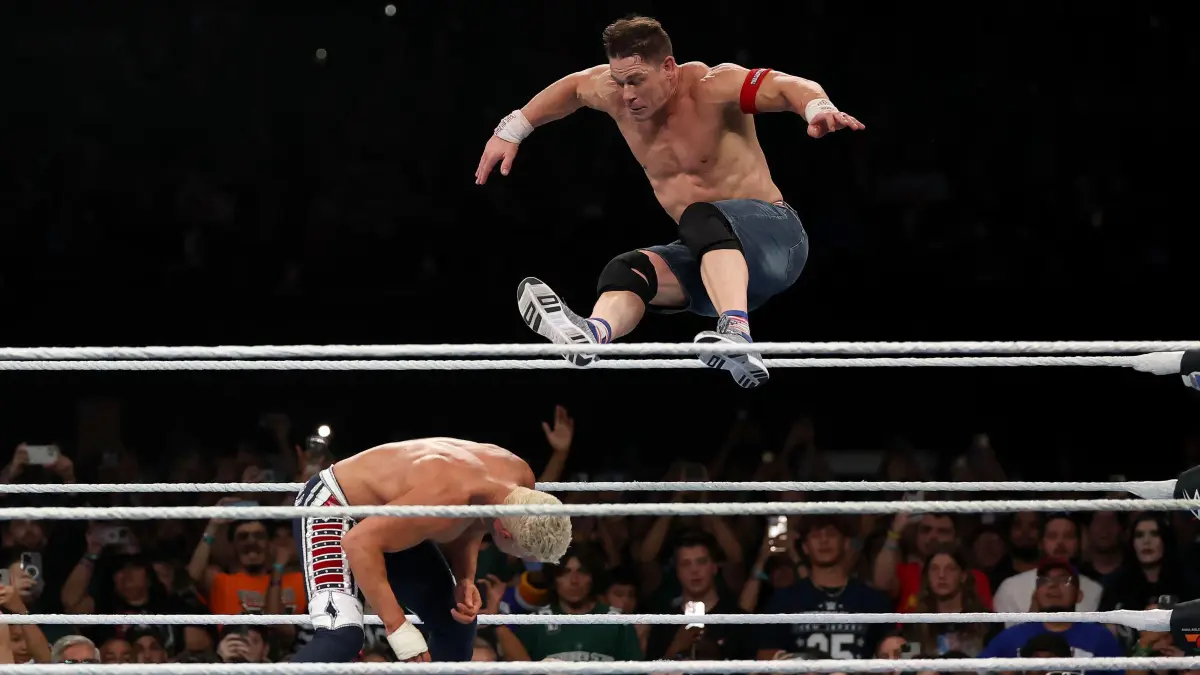 WWE - 2025 SummerSlam: EAST RUTHERFORD, NEW JERSEY - AUGUST 03: John Cena jumps off the top rope and takes down Cody Rhodes during the WWE 2025 SummerSlam at MetLife Stadium on August 03, 2025 in East Rutherford, New Jersey. Elsa/Getty Images/AFP (Photo by ELSA / GETTY IMAGES NORTH AMERICA / Getty Images via AFP)