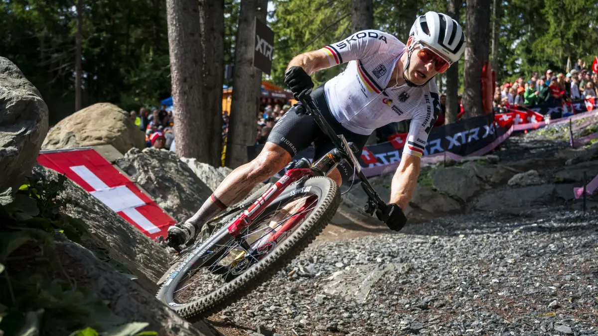 Germany's Luca Schwarzbauer competes during the Men's elite Cross-country Olympic race as part of the 2025 UCI Mountain Bike World Championships in Crans-Montana on September 14, 2025. (Photo by Fabrice COFFRINI / AFP)