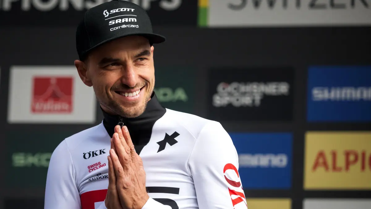 Former Olympic and multiple World champion, Switzerland's Nino Schurter reacts after his last World Championships event on the podium of the Men's elite Cross-country Olympic race as part of the 2025 UCI Mountain Bike World Championships in Crans-Montana on September 14, 2025. (Photo by Fabrice COFFRINI / AFP)
