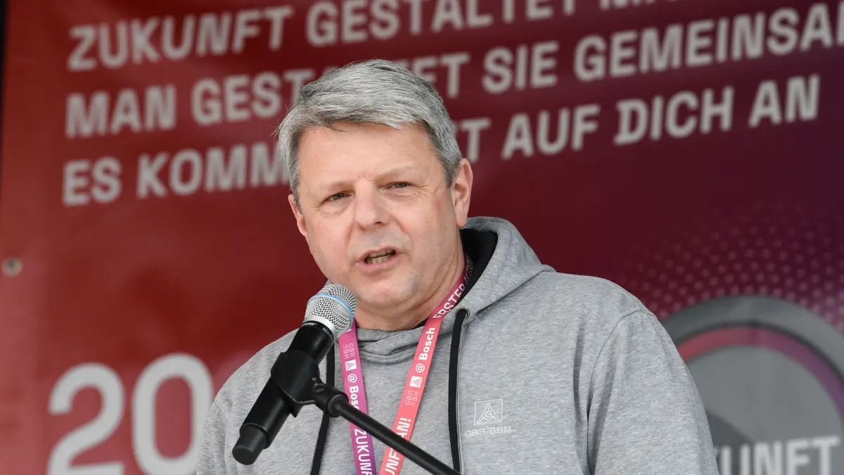 Frank Sell, chairman of the joint works council of Bosch Mobility Solution, speaks during a rally of employees of German technology company Bosch protesting against the company's plans to cut thousands of jobs at the company's headquarters in Gerlingen near Stuttgart, southwestern Germany on March 20, 2024. (Photo by THOMAS KIENZLE / AFP)