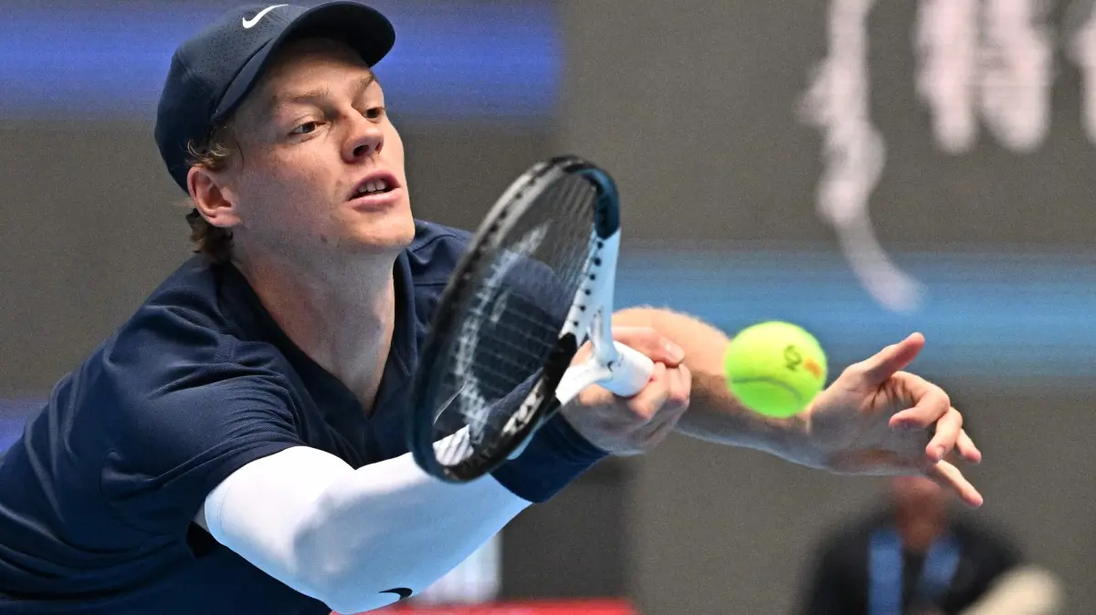 Italy's Jannik Sinner hits a return to US' Learner Tien during their men's singles final match at the China Open tennis tournament in Beijing on October 1, 2025. (Photo by Pedro Pardo / AFP)