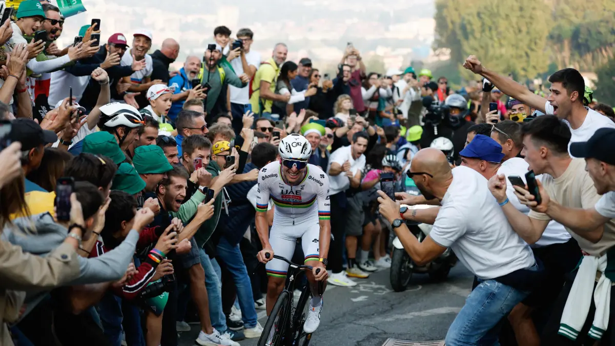 UAE Team Emirates’s Slovenian rider Tadej Pogacar cycles in a lone breakaway in the final ascent to Bergamo to win the 119th edition of the Giro di Lombardia (Tour of Lombardy), a 238km cycling race from Como to Bergamo on October 11, 2025. (Photo by Luca Bettini / POOL / AFP)