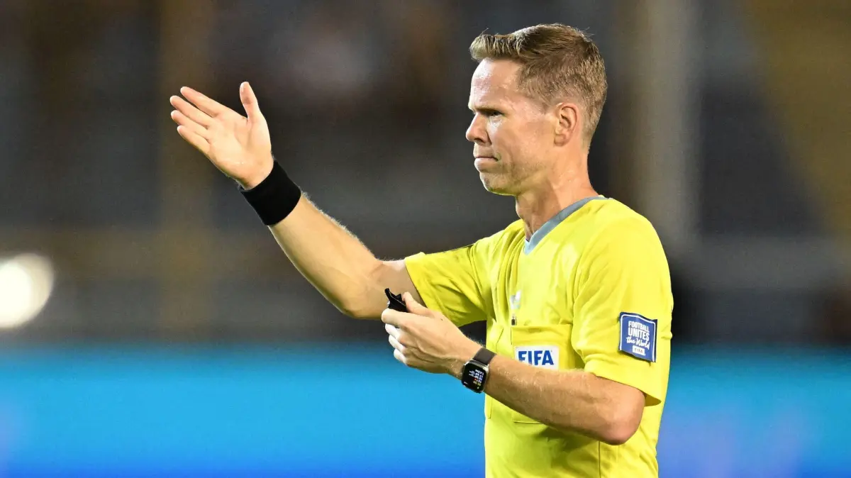 Canadian referee Drew Fischer gestures during the 2026 FIFA World Cup Concacaf qualifier football match between El Salvador and Panama at the Cuscatlan Stadium in San Salvador on October 10, 2025. (Photo by Marvin RECINOS / AFP)