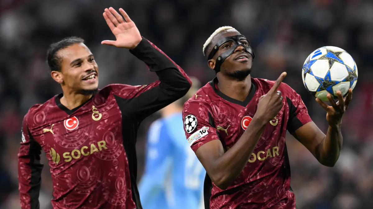 Galatasaray's Nigerian forward #45 Victor Osimhen (R) celebrates scoring his team's third goal with Galatasaray's German midfielder #10 Leroy Sane (L) during the UEFA Champions League, league phase day 4, football match between Ajax and Galatasaray at the Johan Cruijff ArenA in Amsterdam on November 5, 2025. (Photo by JOHN THYS / AFP)