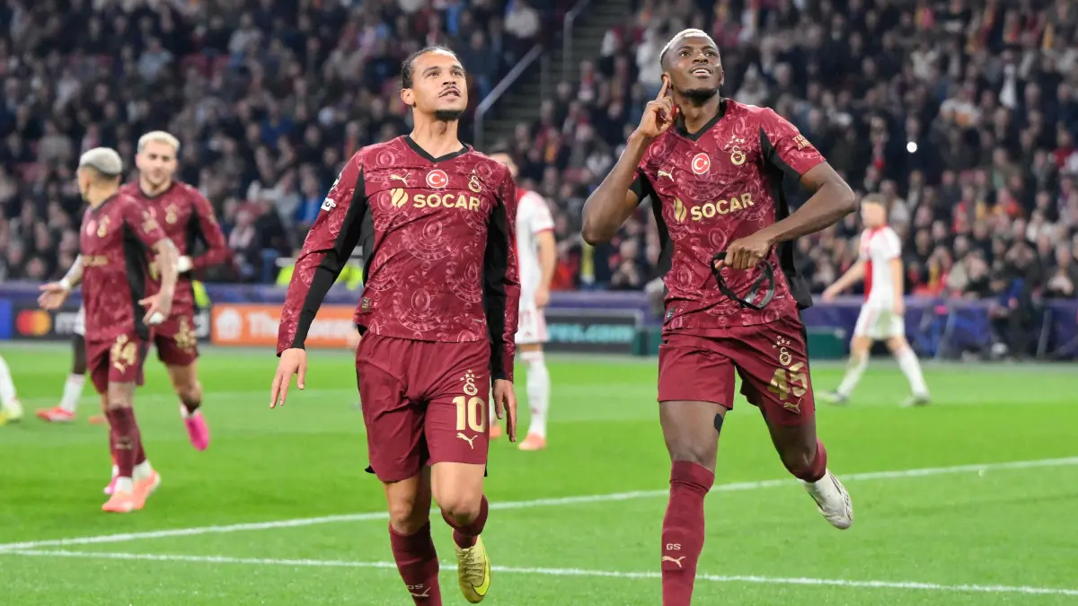 Galatasaray's Nigerian forward #45 Victor Osimhen (R) celebrates scoring his team's second goal with Galatasaray's German midfielder #10 Leroy Sane (L) during the UEFA Champions League, league phase day 4, football match between Ajax and Galatasaray at the Johan Cruijff ArenA in Amsterdam on November 5, 2025. (Photo by JOHN THYS / AFP)
