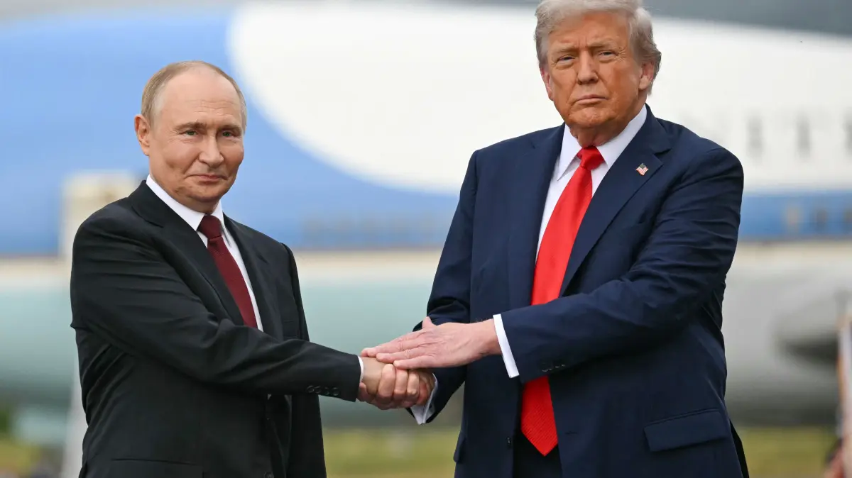 (FILES) US President Donald Trump greets Russian President Vladimir Putin on the tarmac after they arrived at Joint Base Elmendorf-Richardson in Anchorage, Alaska, on August 15, 2025. (Photo by ANDREW CABALLERO-REYNOLDS / AFP)