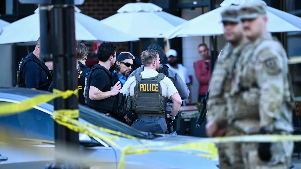 Two National Guard members shot blocks from White House: Law-enforcement officers secure the area after a shooting in downtown Washington, on November 26, 2025. On November 26, Police in Washington said they had detained a suspect after two National Guard troops were shot blocks away from the White House. "The scene is secured. One suspect is in custody," The DC Police posted on X. (Photo by Brendan SMIALOWSKI / AFP)