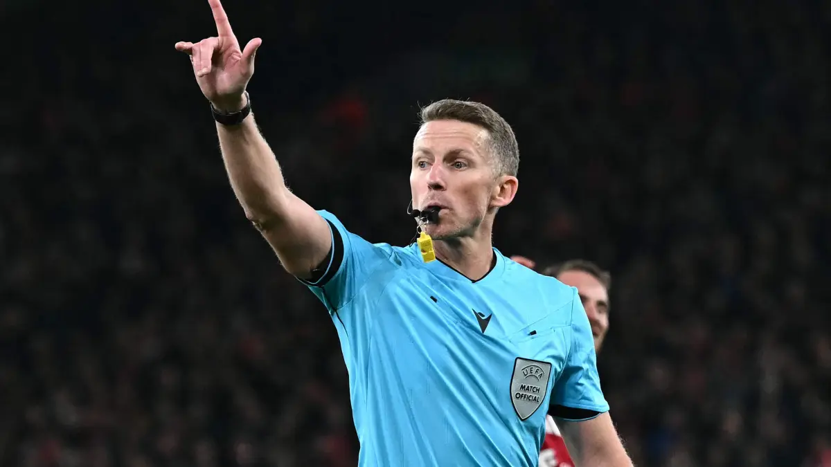 Referee Alejandro Hernandez Hernandez gestures during the UEFA Champions League league phase football match between Liverpool and PSV Eindhoven at Anfield in Liverpool, north west England on November 26, 2025. (Photo by Paul ELLIS / AFP)