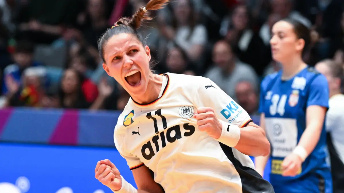 Germany's left back #11 Xenia Smits reacts after she scored during the preliminary round group C match between Germany and Serbia at the IHF Women’s Handball World Championship in Stuttgart, southern Germany, on November 30, 2025. (Photo by THOMAS KIENZLE / AFP)