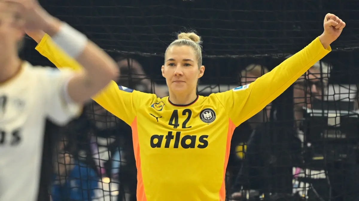 Germany's goalkeeper #42 Katharina Filter celebrates during the main round - Day 5 Group II handball match Montenegro v Germany of the IHF Women's Handball World Championship in Dortmund, western Germany on December 4, 2025. (Photo by INA FASSBENDER / AFP)