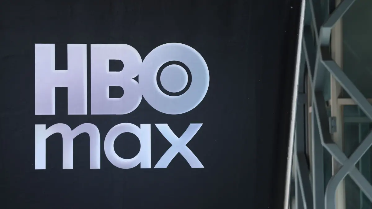 Netflix makes cash offer to buy Warner Bros Discovery: report: The HBO Max logo is seen outside the Warner Bros. Discovery offices in Culver City, California, on December 5, 2025. Streaming giant Netflix said December 5, 2025 it will buy film and television studio Warner Bros. Discovery for nearly $83 billion, the entertainment industry's biggest consolidation deal this decade. The acquisition gives Netflix access to a vast film catalog as well as the prestigious streaming service HBO Max. (Photo by Patrick T. Fallon / AFP)