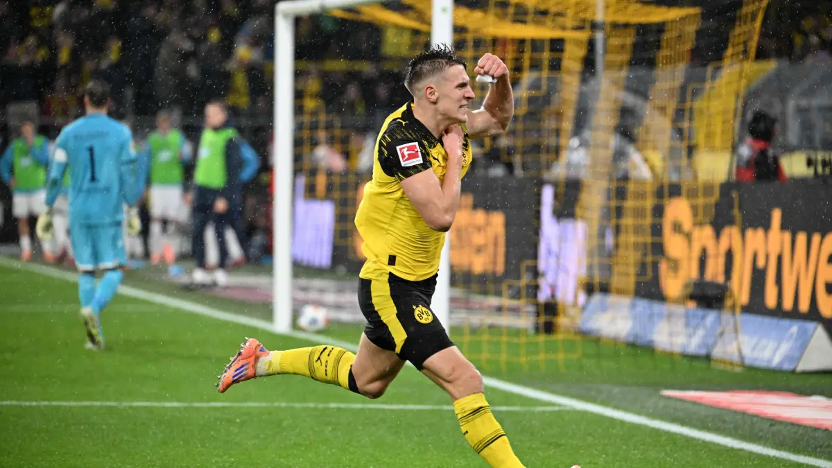 Football: Bundesliga - day 13: Borussia Dortmund v Hoffenheim: Dortmund's German defender #04 Nico Schlotterbeck celebrates after scoring the 2-0 goal during the German first division Bundesliga football match between BVB Borussia Dortmund and TSG 1899 Hoffenheim in Dortmund, western Germany, on December 7, 2025. (Photo by UWE KRAFT / AFP) / DFL REGULATIONS PROHIBIT ANY USE OF PHOTOGRAPHS AS IMAGE SEQUENCES AND/OR QUASI-VIDEO