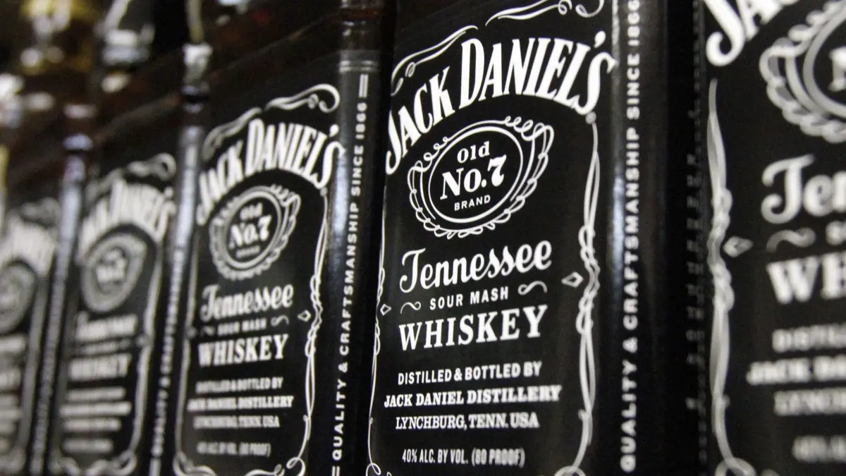 FILE - In this Dec. 5, 2011, file photo, bottles of Jack Daniel's Tennessee Whiskey line the shelves of a liquor outlet in Montpelier, Vt. Brown-Forman Corp. (BF.A) on Wednesday, June 6, 2018, reported fiscal fourth-quarter earnings of $110 million. (AP Photo/Toby Talbot, File)