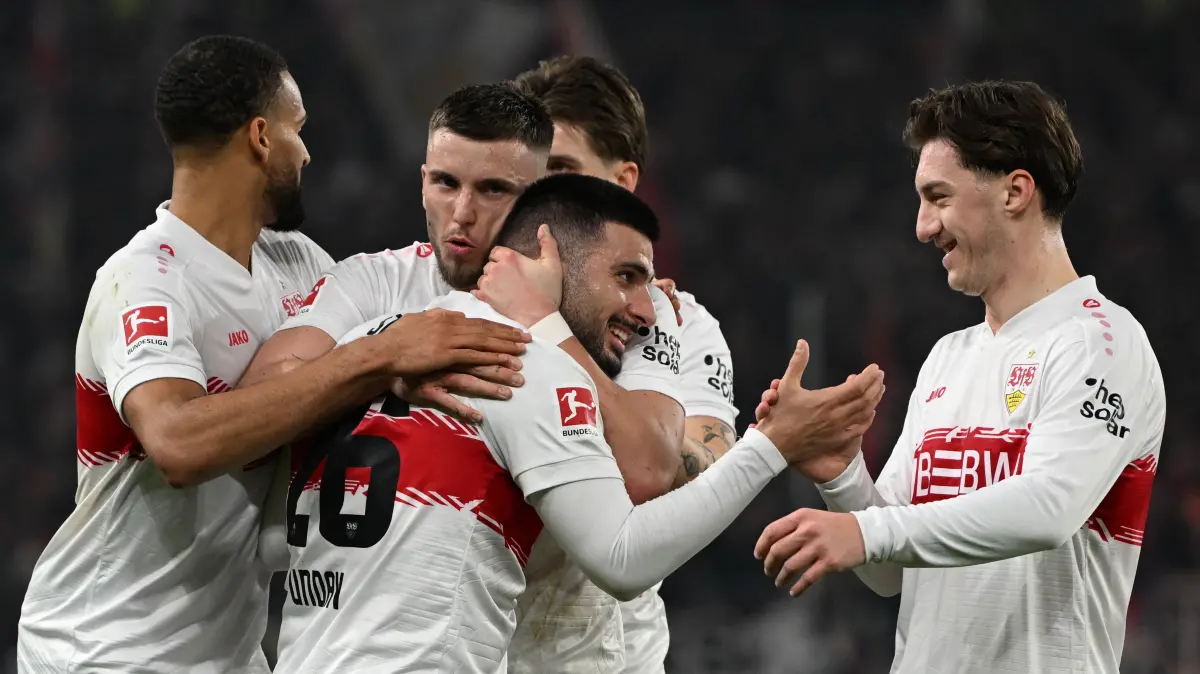 Stuttgart's German forward #26 Deniz Undav celebrates with his tam mates after scoring his team's second goal 2:1 during the German first division Bundesliga football match between VfB Stuttgart and Eintracht Frankfurt in Stuttgart, southern Germany, on January 13, 2026. (Photo by THOMAS KIENZLE / AFP) / DFL REGULATIONS PROHIBIT ANY USE OF PHOTOGRAPHS AS IMAGE SEQUENCES AND/OR QUASI-VIDEO